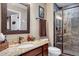 Bathroom featuring granite counters, a vessel sink, and a step-in shower with stone tile surround at 27625 E Moraine Dr, Aurora, CO 80016