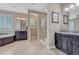 Elegant bathroom with a soaking tub, double vanities, and a separate glass-enclosed shower at 27625 E Moraine Dr, Aurora, CO 80016