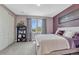Comfortable bedroom with ample natural light and neutral tones, featuring a closet and stylish accents at 27625 E Moraine Dr, Aurora, CO 80016