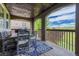Covered outdoor deck with a dining set, string lights, and view of the neighborhood and open space at 27625 E Moraine Dr, Aurora, CO 80016