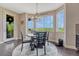 Bright eat in dining area showcases a large picture window with a golf course view at 27625 E Moraine Dr, Aurora, CO 80016