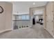 Upstairs hallway with neutral carpeting and a view into the main bedroom suite at 27625 E Moraine Dr, Aurora, CO 80016