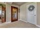 Entryway to wine room featuring carpet floors, and glass door at 27625 E Moraine Dr, Aurora, CO 80016
