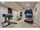 Basement workout room with equipment including a treadmill, bench and weight rack at 27625 E Moraine Dr, Aurora, CO 80016