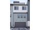 Modern townhome features a spacious gray garage, complemented by contemporary exterior paint colors at 10177 E 62Nd Ave, Denver, CO 80238