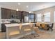 Modern kitchen featuring stainless steel appliances, granite countertops, and a breakfast bar with seating at 10177 E 62Nd Ave, Denver, CO 80238