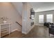 Open living room with a modern fireplace and entertainment area, perfect for relaxing and entertaining guests at 10177 E 62Nd Ave, Denver, CO 80238