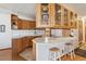 Charming kitchen with wooden cabinets, a breakfast bar, and ample counter space at 9942 Lane St, Thornton, CO 80260