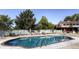 Outdoor pool with lounge chairs and umbrellas for community residents at 9942 Lane St, Thornton, CO 80260