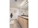 Clean and modern bathroom with neutral colors, tile flooring, and modern fixtures at 5677 S Park Pl # D310, Greenwood Village, CO 80111