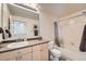 Well-maintained bathroom featuring a vanity with ample storage and a shower-tub combo at 5677 S Park Pl # D310, Greenwood Village, CO 80111
