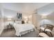 Cozy bedroom features soft lighting and a comfortable bed, creating a relaxing retreat at 5677 S Park Pl # D310, Greenwood Village, CO 80111