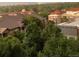 Overlooking the rooftops and treetops is a stunning rainbow in this aerial shot at 5677 S Park Pl # D310, Greenwood Village, CO 80111