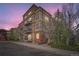 Exterior view of a multi-story building with balconies and tasteful landscaping at 5677 S Park Pl # D310, Greenwood Village, CO 80111