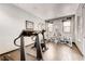 Bright gym with a variety of exercise machines, large mirror, and natural light creating a great workout space at 5677 S Park Pl # D310, Greenwood Village, CO 80111