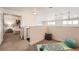 Upstairs area with doorway to the bedroom and open space for yoga with yoga mat at 5677 S Park Pl # D310, Greenwood Village, CO 80111