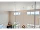 An open-concept living area with soaring ceilings and a modern fireplace at 5677 S Park Pl # D310, Greenwood Village, CO 80111