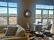 Bright and cozy dining area with views from large windows, and a comfortable sitting area at 5677 S Park Pl # D310, Greenwood Village, CO 80111