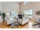 Bright living room area featuring a fireplace, hardwood floors and a large window view at 5677 S Park Pl # D310, Greenwood Village, CO 80111