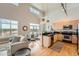 Living space offering a blend of comfort and style with sleek stainless steel appliances in the background at 5677 S Park Pl # D310, Greenwood Village, CO 80111