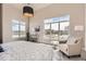 Bright main bedroom with a decorative lamp, arm chair, large windows with amazing natural light at 5677 S Park Pl # D310, Greenwood Village, CO 80111