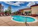 Inviting community pool and hot tub with plenty of lounge chairs, perfect for relaxing in the sun with friends at 5677 S Park Pl # D310, Greenwood Village, CO 80111