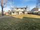 Expansive backyard with lush lawn and mature trees at 1703 S Moline Ct, Aurora, CO 80012