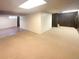 Spacious finished basement with carpet and wood paneling offers flexible living space at 1703 S Moline Ct, Aurora, CO 80012