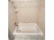 Tiled bathtub and shower combination in an updated bathroom at 1703 S Moline Ct, Aurora, CO 80012