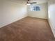 A bedroom featuring carpet, neutral walls, and a single window at 1703 S Moline Ct, Aurora, CO 80012