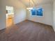 Cozy dining room featuring a chandelier and a large window with a view to the outside and neutral wall paint at 1703 S Moline Ct, Aurora, CO 80012