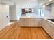 Open kitchen featuring marble countertops, stainless steel appliances and light wood flooring at 1703 S Moline Ct, Aurora, CO 80012