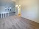 Bright living room with neutral wall paint and carpet and recessed lighting, and a chandelier at 1703 S Moline Ct, Aurora, CO 80012