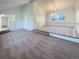 Bright living room featuring a carpeted floor, recessed lighting, and a large window with lots of natural light at 1703 S Moline Ct, Aurora, CO 80012