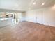 Carpeted living room with neutral wall paint and an open layout to an adjacent room at 1703 S Moline Ct, Aurora, CO 80012