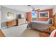 This bedroom features natural light from a large window, a ceiling fan, and ample storage space at 4570 E Yale Ave # 1104, Denver, CO 80222