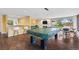 Community game room with bar seating, lounge area, and recreation space leading to an outdoor pool at 4570 E Yale Ave # 1104, Denver, CO 80222