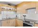 Stylish kitchen with modern cabinets, ample counter space, and elegant lighting fixtures at 4570 E Yale Ave # 1104, Denver, CO 80222