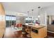 Open kitchen with a spacious island, and connecting living spaces at 4570 E Yale Ave # 1104, Denver, CO 80222