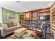 Inviting living room with custom wood bookshelves and large decorative rug at 4570 E Yale Ave # 1104, Denver, CO 80222