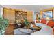 Comfortable living room featuring hardwood floors and custom wood built-ins at 4570 E Yale Ave # 1104, Denver, CO 80222