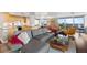 Open-concept living space with modern furnishings, city views, and hardwood floors at 4570 E Yale Ave # 1104, Denver, CO 80222