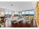 Bright living room with hardwood floors, a balcony and views of the mountains at 4570 E Yale Ave # 1104, Denver, CO 80222