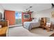 Bedroom with a king bed, a large window with mountain views, and built-in shelving at 4570 E Yale Ave # 1104, Denver, CO 80222