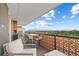 Spacious outdoor patio offering comfortable seating and expansive views of the city skyline and mountains at 4570 E Yale Ave # 1104, Denver, CO 80222