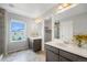 Primary bath with dual sinks, granite counters, and walk-in shower offers plenty of space at 4760 Kittredge St, Denver, CO 80239