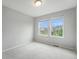 Bright bedroom with two windows offering neighborhood views and ample natural light at 4760 Kittredge St, Denver, CO 80239