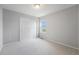 Bedroom with double door closet and large window at 4760 Kittredge St, Denver, CO 80239