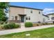 Charming two-story home with well-maintained lawn and inviting front entrance, showcasing modern design at 4760 Kittredge St, Denver, CO 80239