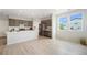 Modern kitchen with stainless steel appliances, white countertops, and hardwood floors offering an open layout at 4760 Kittredge St, Denver, CO 80239